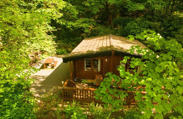 Luxury pine log cabin positioned within the mountains of the Lake District
