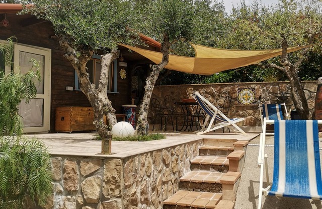 Magnificent cottage surrounded by olive trees and aromatic plants.