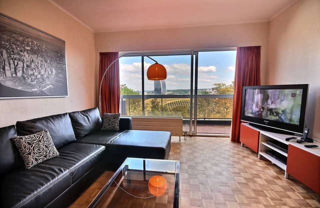 Magnificient view in a tree-filled setting | Adelo