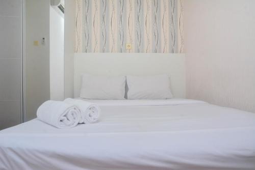 Minimalist and Warm 2BR at Bassura City Apartment By Travelio