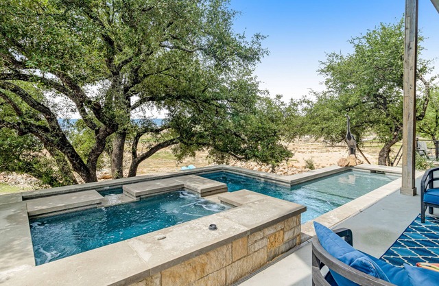 Modern charmer with gleaming lake views, pool, fireplace, & grill - dog-friendly