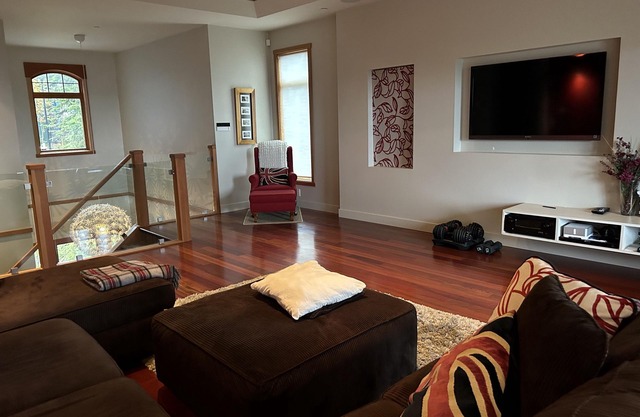 Modern home with private hot tub, sauna, heated floors and private suite.