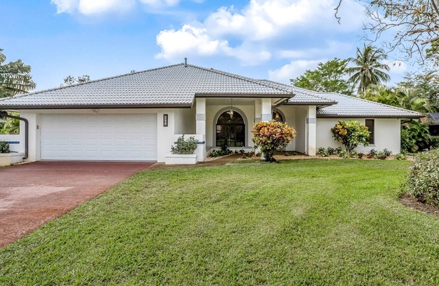 Modern home in great location with private heated pool, lanai & charming patio