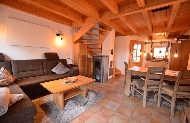 Modern vacation home by the lake in the Via Claudia vacation village with balcony and fireplace