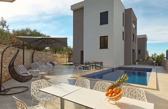 Modern villa in Podstrana near Split with a swimming pool and an elevator
