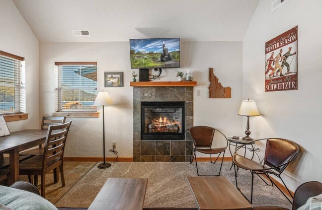 Nest in comfort and watch ospreys soar above Lake Pend Oreille. This Dover Bay hideaway blends nature, peace, and effortless style.