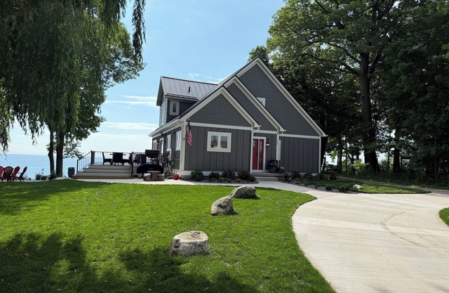 NEW & IMPROVED Spectacular beach front home on Lake Michigan