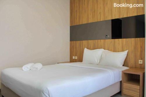 Nice and Enjoy 1BR at Sudirman Suites Apartment By Travelio