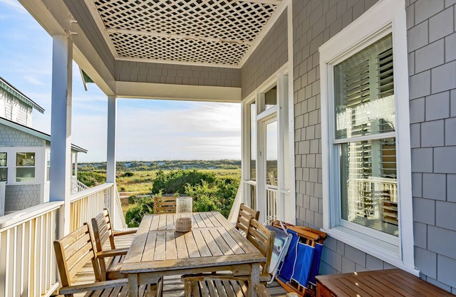 Ocean front duplex with master balcony overlooking the beach; newer six passenger golf cart