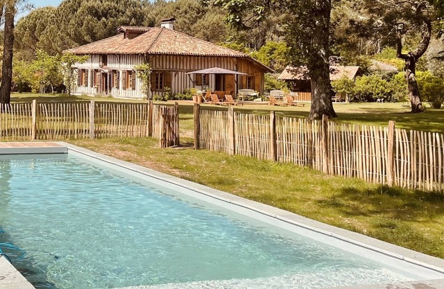 Old traditional house at the Maisons Huraia between forest, lake and ocean