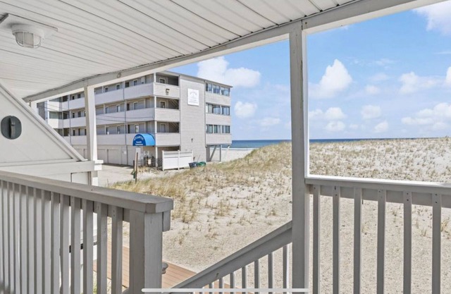 On the Beach-Dog Friendly 2BR Condo walk to the waves.