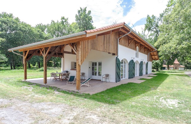 One-story house in a forest park on the shore of the lake, ocean 8 km away.