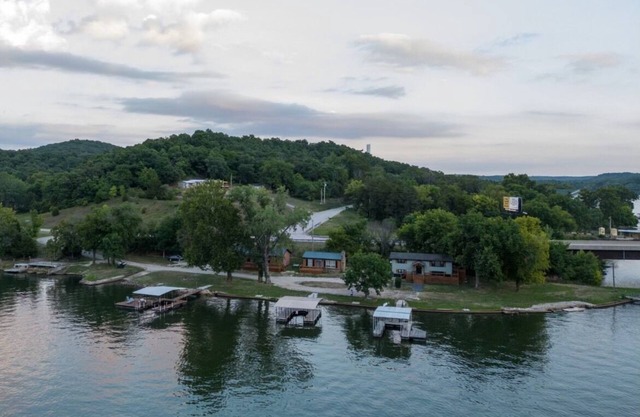 Private Island Retreat with 500' Level Lakefront & 3 Houses with Private Docks!