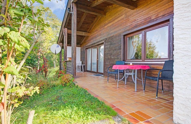 Quaint Chalet with Garden Terrace Fireplace Play Equipment