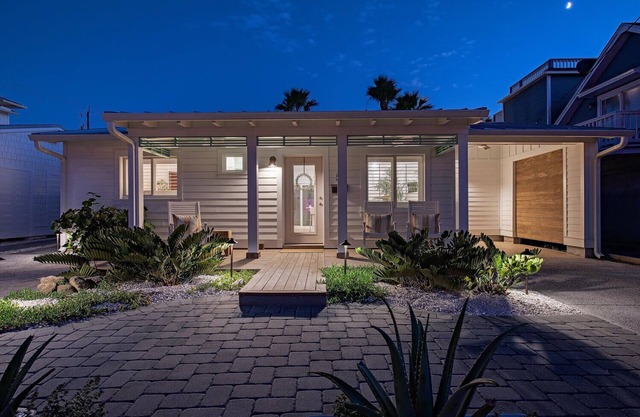 Recently Remastered Beachside Boat House STEPS from the Ocean with HEATED pool.