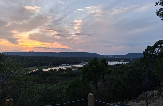 Secluded RV on mountain bluff overlooking lake with large deck. Hiking &biking