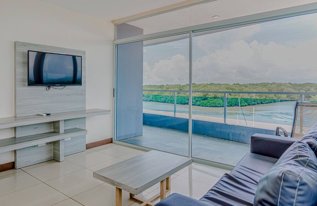 Serene condo with ocean views, modern amenities & pool access