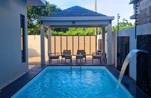 Serenity I Villa : 4 Ensuite Bedrooms, Heated Pool Feature & Cozy Living Spaces.