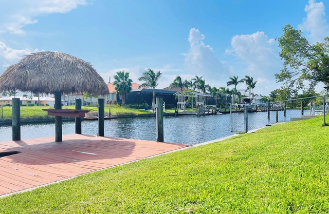 Short Distance From Tarpon Point Marina! Gulf Access, Heated Pool, Dock & Tiki!