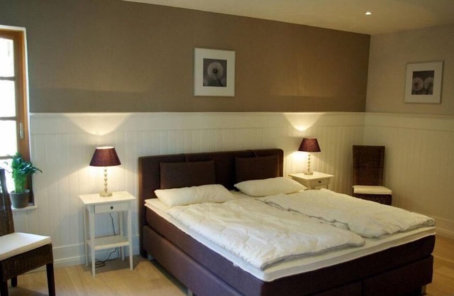 Small holiday apartment with a bow front and a great view of the natural pond