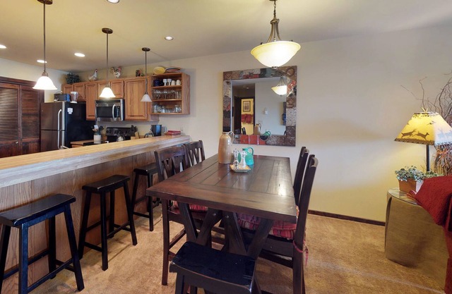 Spacious condo with balcony, lake view, and full kitchen - walk to the water