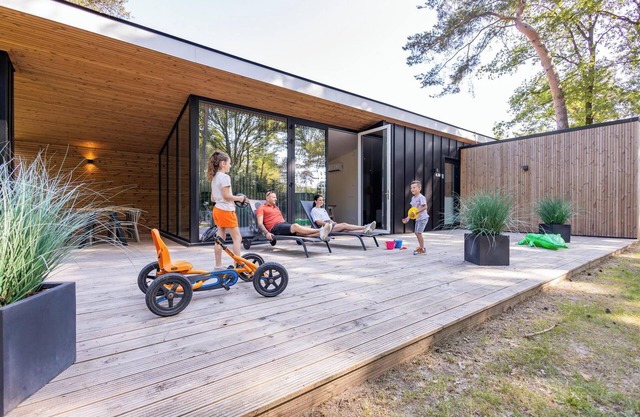 Spacious eco-cottage for six, with modern kitchen and large terrace, set in peaceful woodlands at Breebronne in North Limburg.
