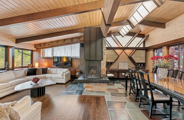 Spacious MCM home blends elegance w/retro charm. Includes pool, steam and sauna