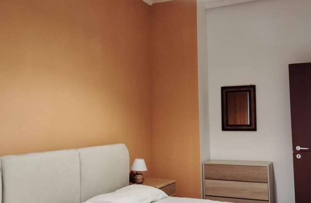 Spacious one-bedroom apartment with balcony steps from the harbor and beaches