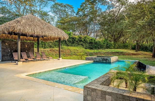 Spacious tropical home with private pool & hot tub, AC, and modern amenities