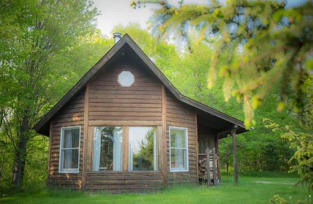 Spiral Staircase Leads To The Lofted Bedroom With Wall To Wall Knotty Pine.