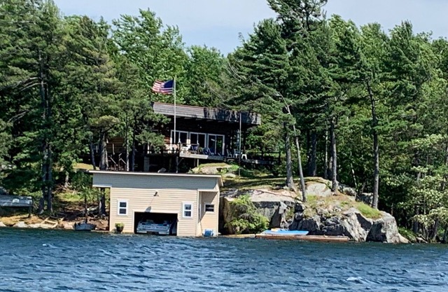 St. Lawrence River Cottage with 107 ft of river frontage and a boathouse