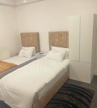 studio apartment with small kitchen and bathroom