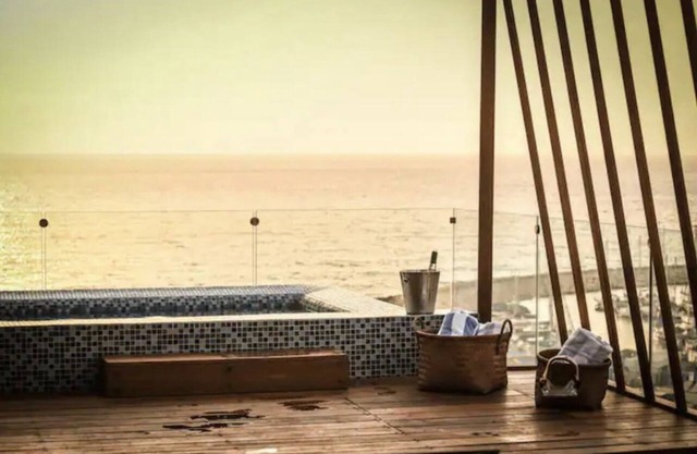 Stunning beachfront duplex penthouse with infinity rooftop pool & parking