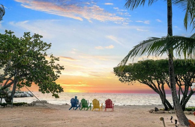 Stunning property with private beach, boat dock and heated pool.