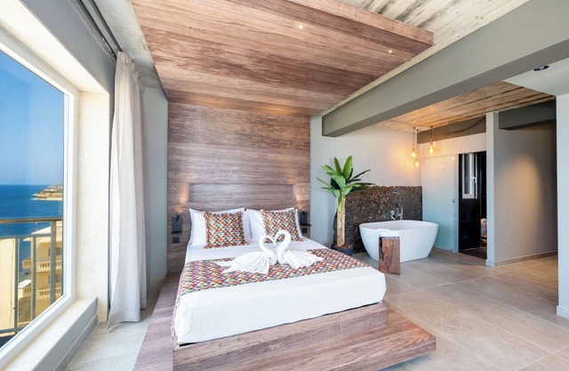Sunny Corner Suite with Sea View and Bath 402