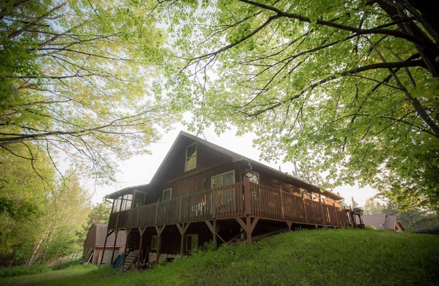 The Cedar House Is Uniquely Set In The Forest Surrounded By Decks And Porches.
