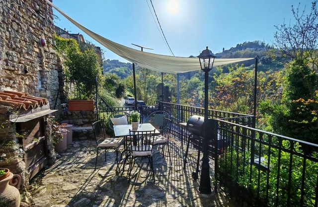 The cozy little house with terrace in the medieval walls