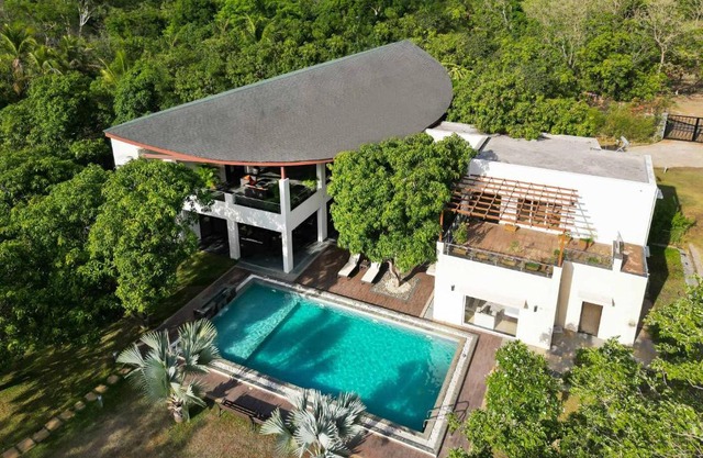 The Leaf by StayVista - An enchanting escape offering a pool, terrace, lush lawn, contemporary interiors, and indoor games