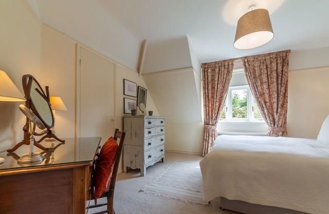 This much-loved detached family holiday home is set in glorious secluded gardens
