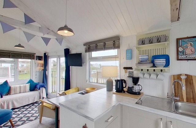 This snug chalet is just a short walk from three miles of sandy surf.