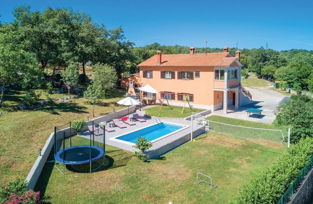 This vacation home with pool has a spacious outdoor area and konoba (social room).