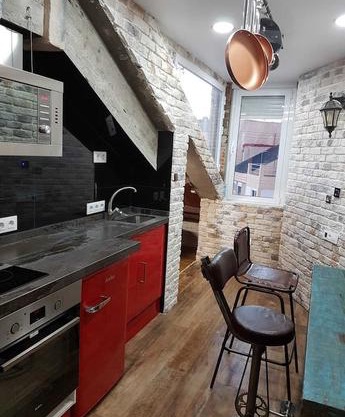 Tiny and cute apartment in the roof touching border
