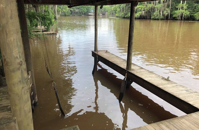 Two Story House with deck over the river