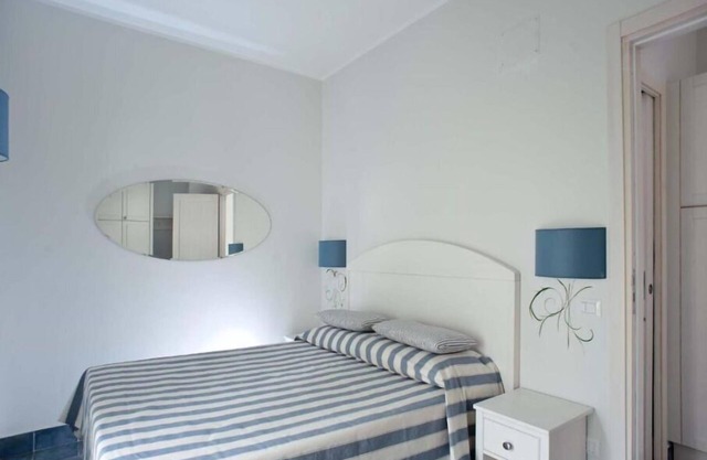 Ulivo Apartment in the Residence le Ruve Bianche with swimming pool and private beach