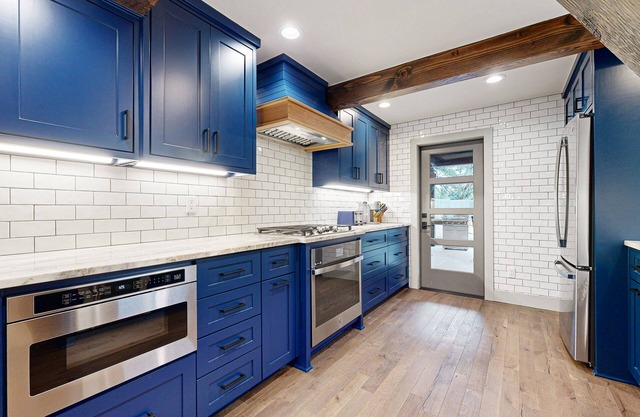 Unique retreat with pickleball, cornhole, decks, grill, fireplace, AC, & W/D