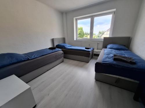 Unterkunft mit 4 Schlafzimmern - ideal gelegen bei Flughafen, Porsche & DHL