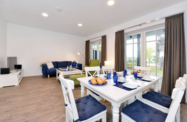 Vacation apartment with modern furnishings, terrace and sea view in Ralswiek