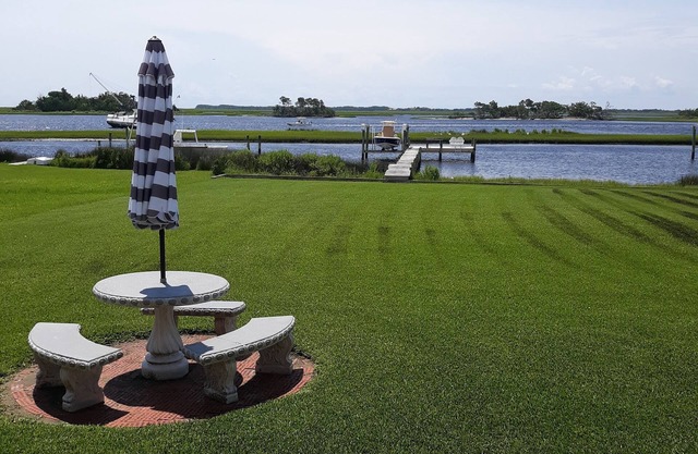 View of intracoastal waterway with private dock and boat lift.