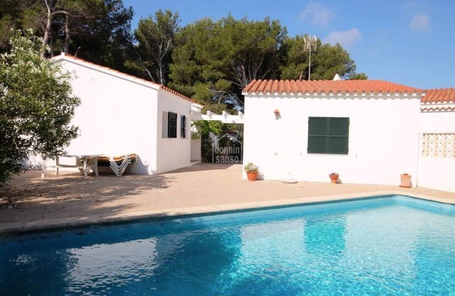 Villa with private pool in Port Addaia . Surrounded by pine trees .