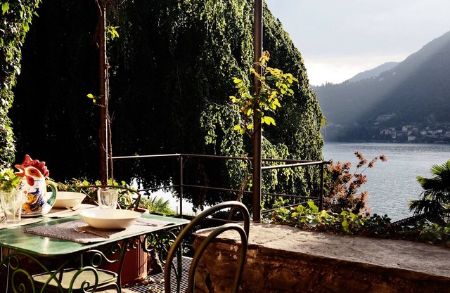 Village house with garden overlooking the lake